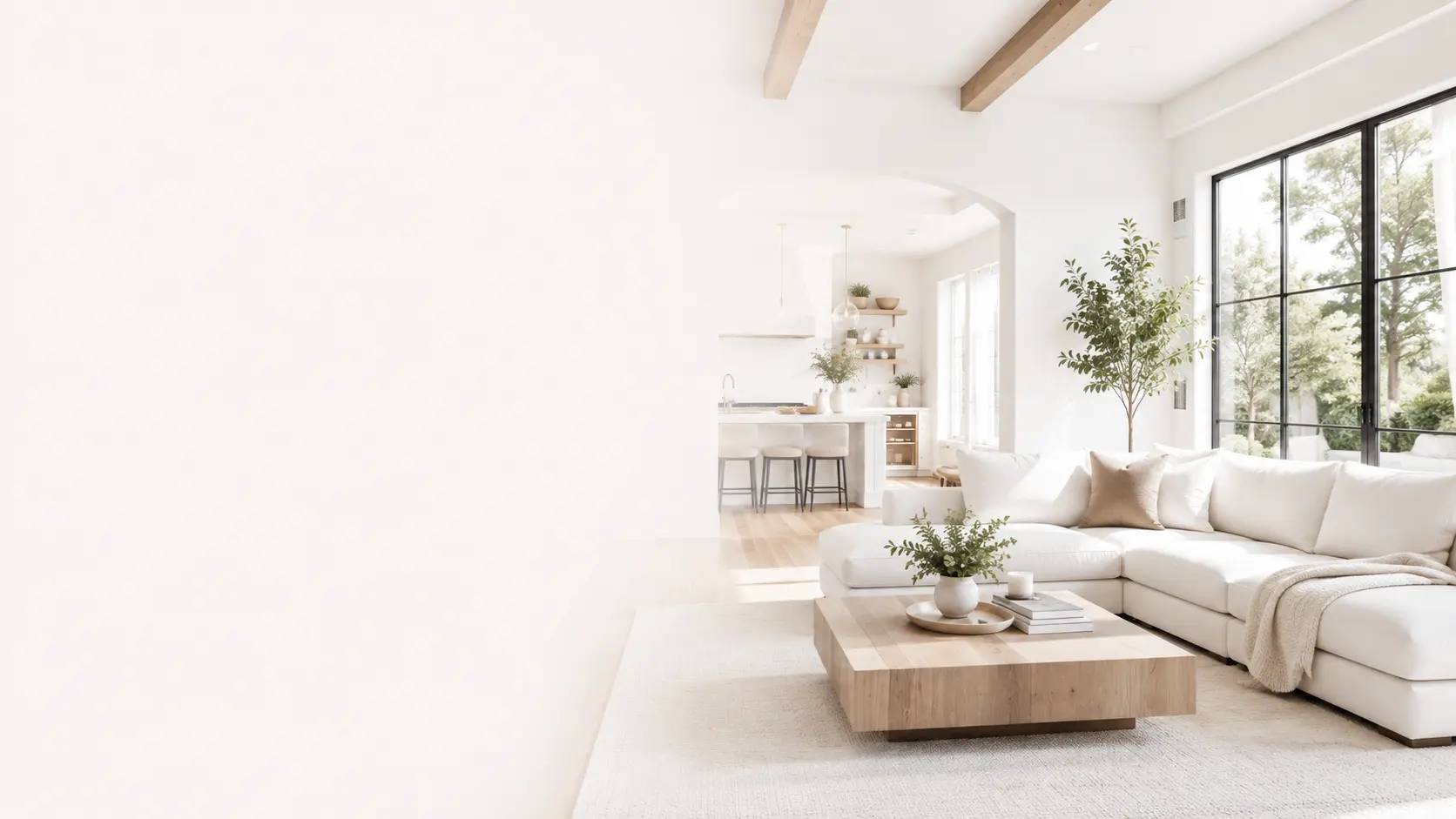 A bright, freshly cleaned living room opening onto a kitchen